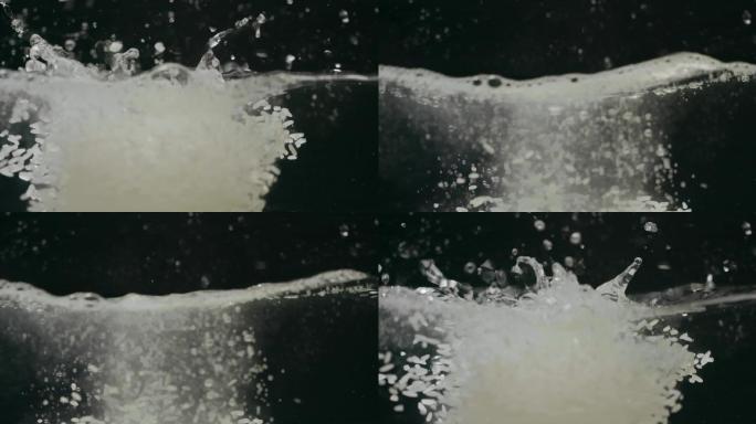 白色稻米倒入水中慢镜头升格视频
