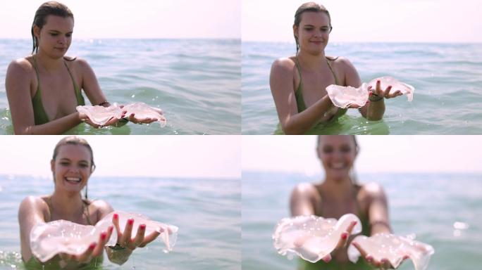 两只水母在手比基尼海边沙滩擦边球