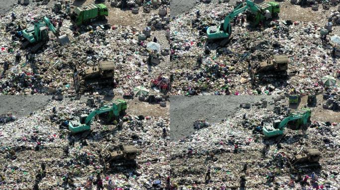 垃圾填埋场，垃圾车处理垃圾，鸟瞰图
