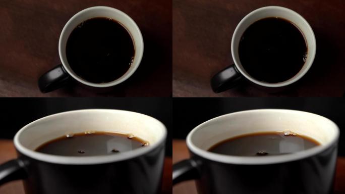 杯子里倒黑咖啡特写镜头