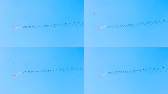 一串串风筝在蓝天上飞翔