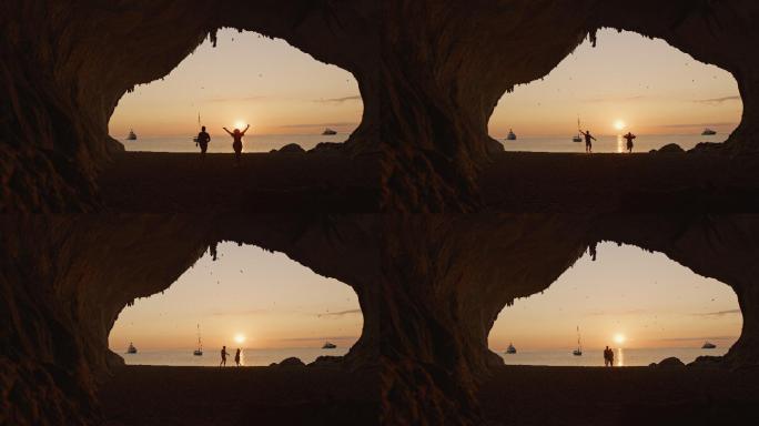 意大利撒丁岛卡拉卢纳，一对夫妇在海滩上跑步的慢镜头。