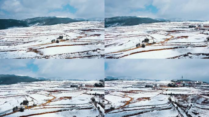 晴天蓝天下阳光照耀冬季白雪覆盖山川田野