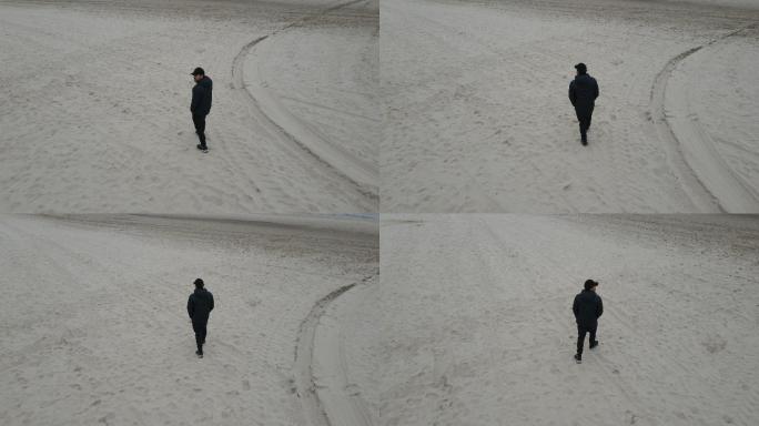 一个人孤独地走在德国北海的海滩上