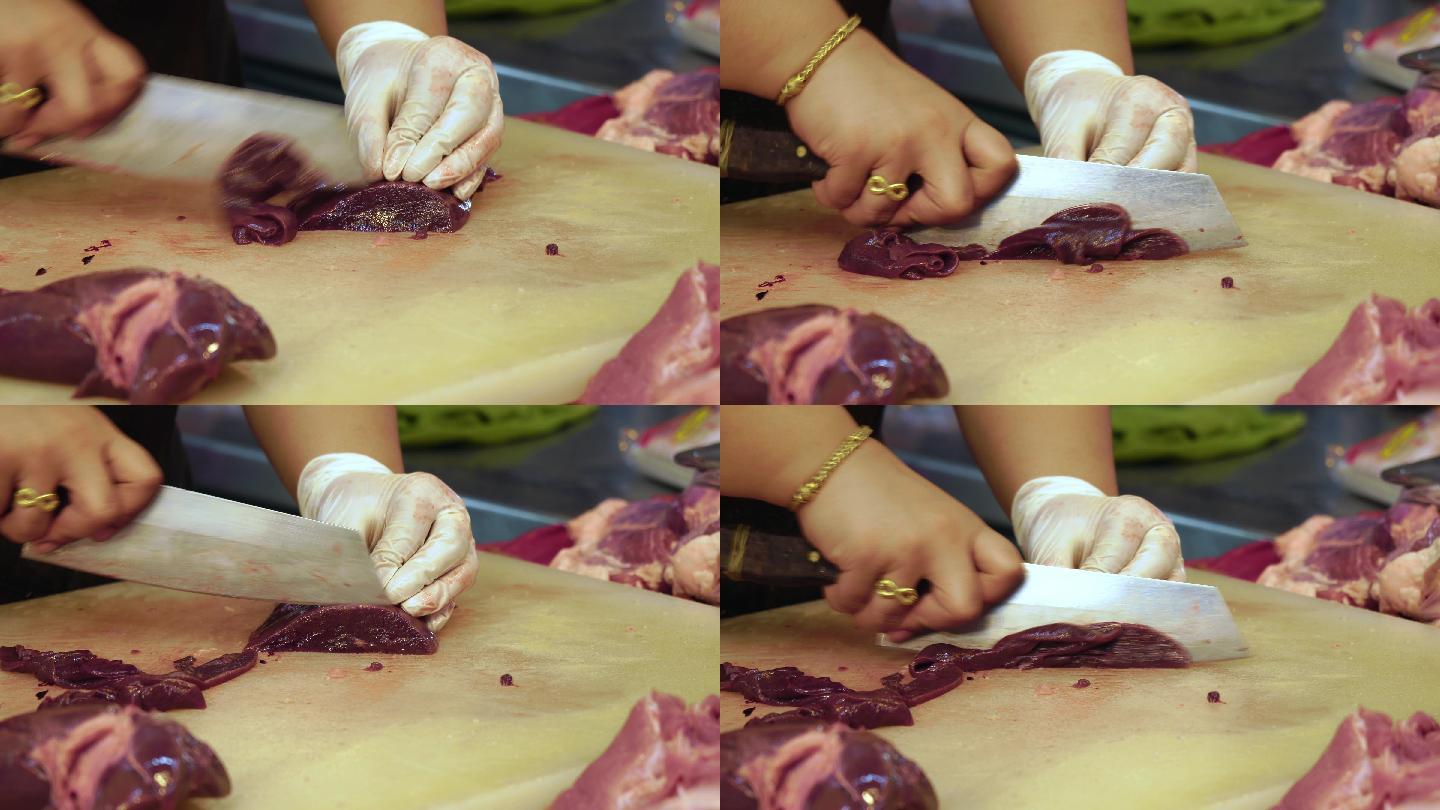 在鲜活超市里，屠夫用刀子割下动物肝脏，拍下屠夫的双手。