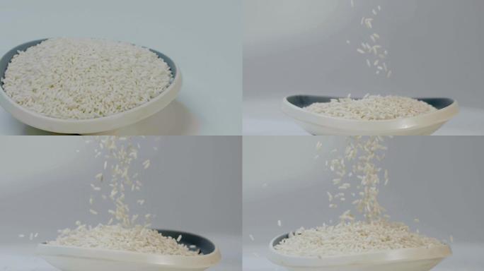 白色糯米落入瓷碗慢镜头升格视频