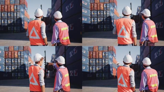 两名亚洲男性工程师在港口工作