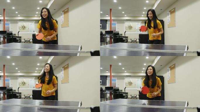 在办公室休息室打乒乓球的女人