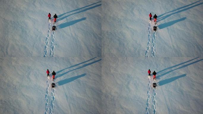 4K鸟瞰视频家庭雪鞋在冬季日落时户外
