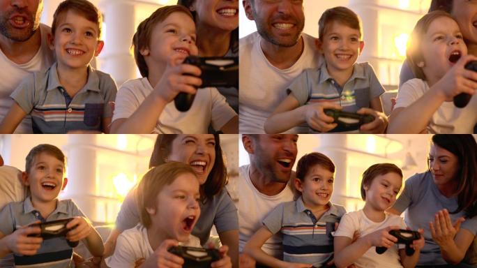 快乐的家庭在家玩电子游戏时玩得很开心。