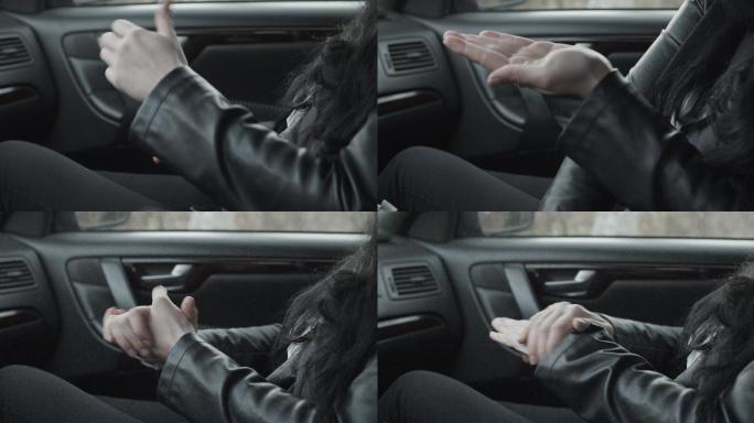 车里的女人用洗手液洗手。每秒50帧