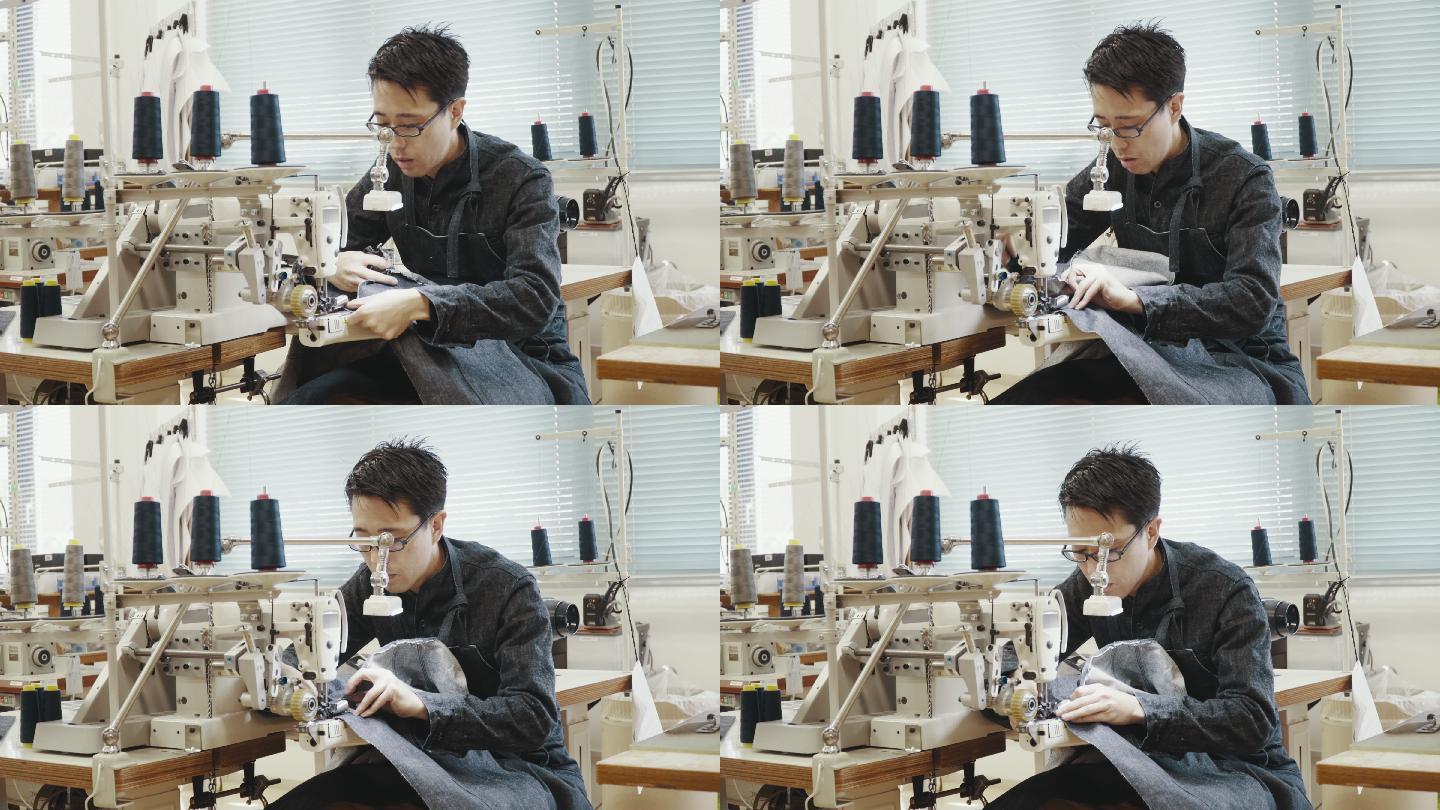 一位中年裁缝在设计工作室的缝纫机前工作的中镜头