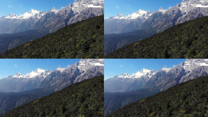 中国丽江的林地和玉龙雪山景观的4k鸟瞰图和推拉背景。