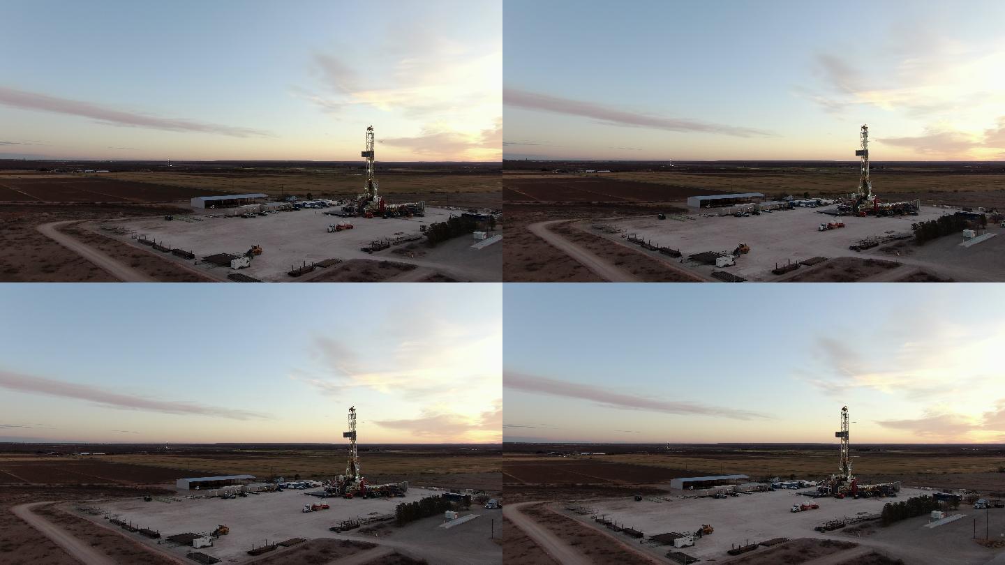 新墨西哥州太阳升起时，无人机俯瞰石油或天然气钻井压裂井场