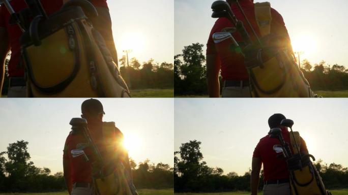 高尔夫球手提着高尔夫球袋沿球道行走