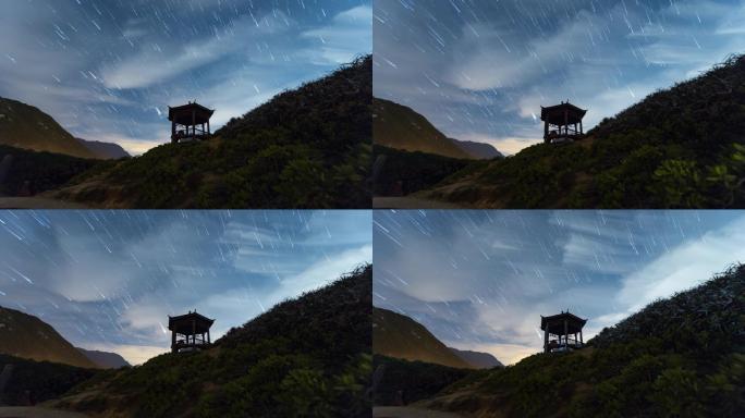 夏季银河星轨流星雨下的亭子和高山