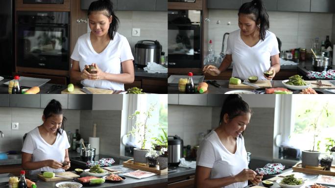 一名泰国妇女正在准备新鲜鳄梨，作为她将要制作的传统寿司卷的主要原料