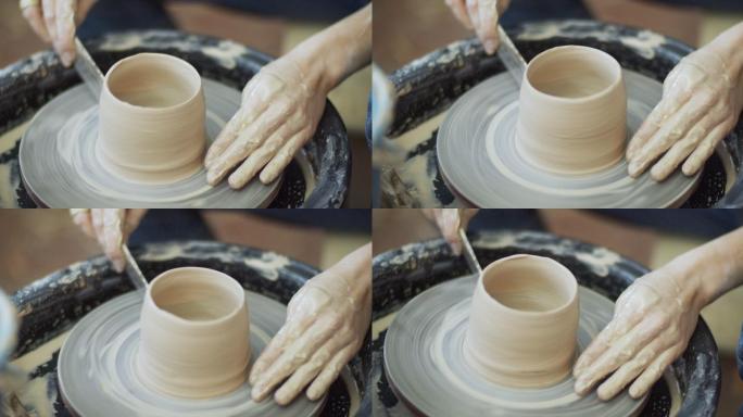 年轻女子在她的陶器车间制作陶瓷，小企业理念