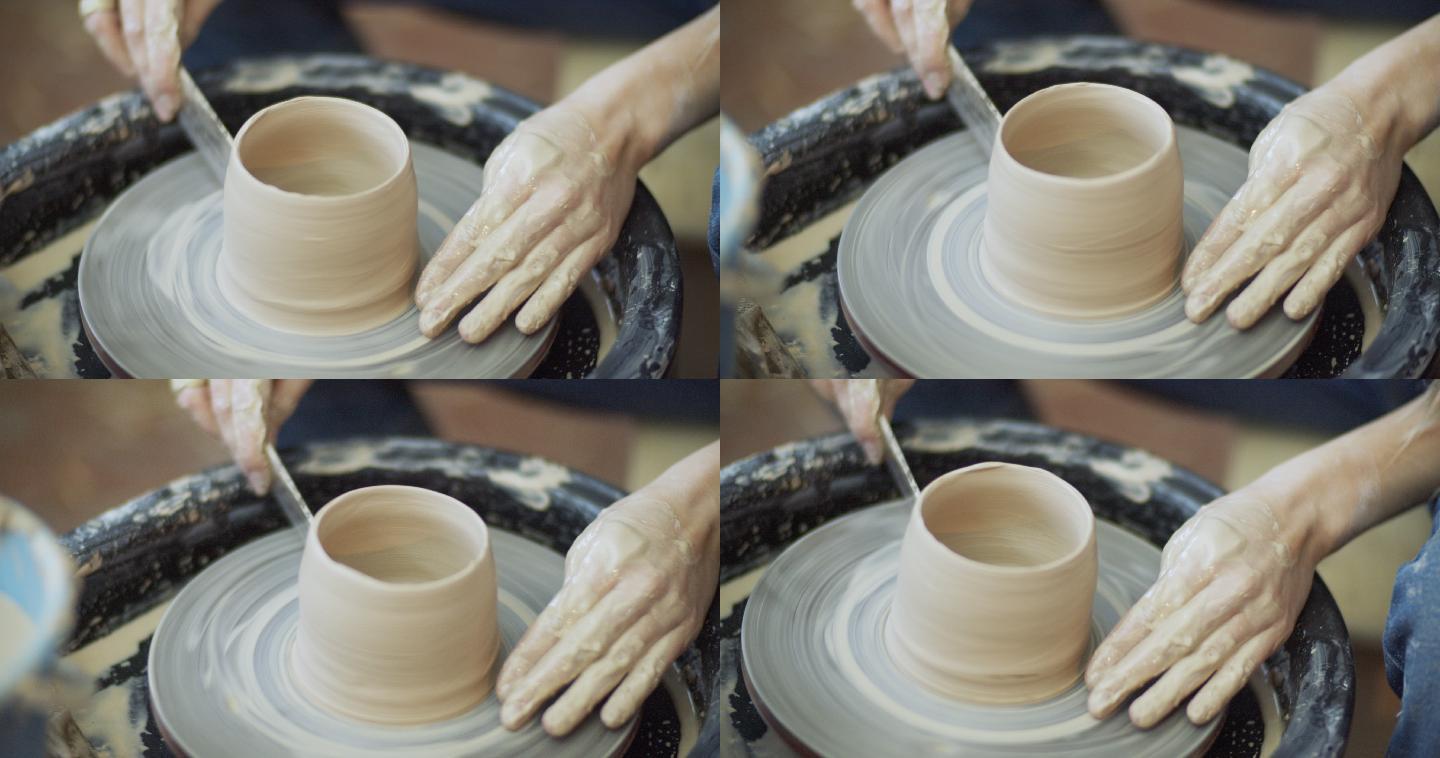 年轻女子在她的陶器车间制作陶瓷，小企业理念