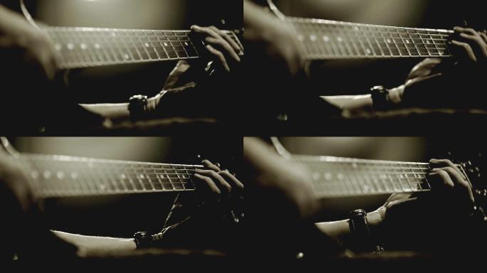 吉他手弹吉他弹吉它的手指特写