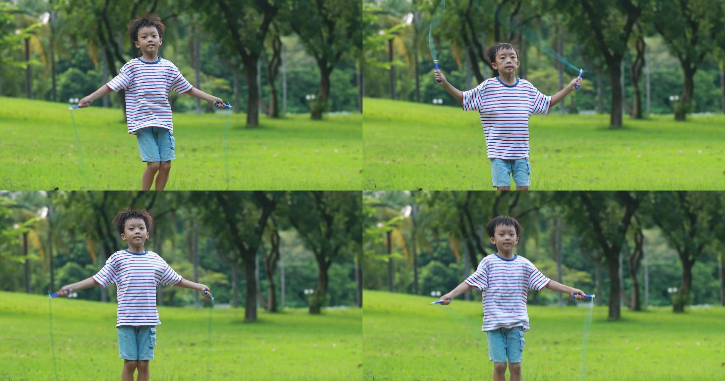 小男孩在草地上跳绳