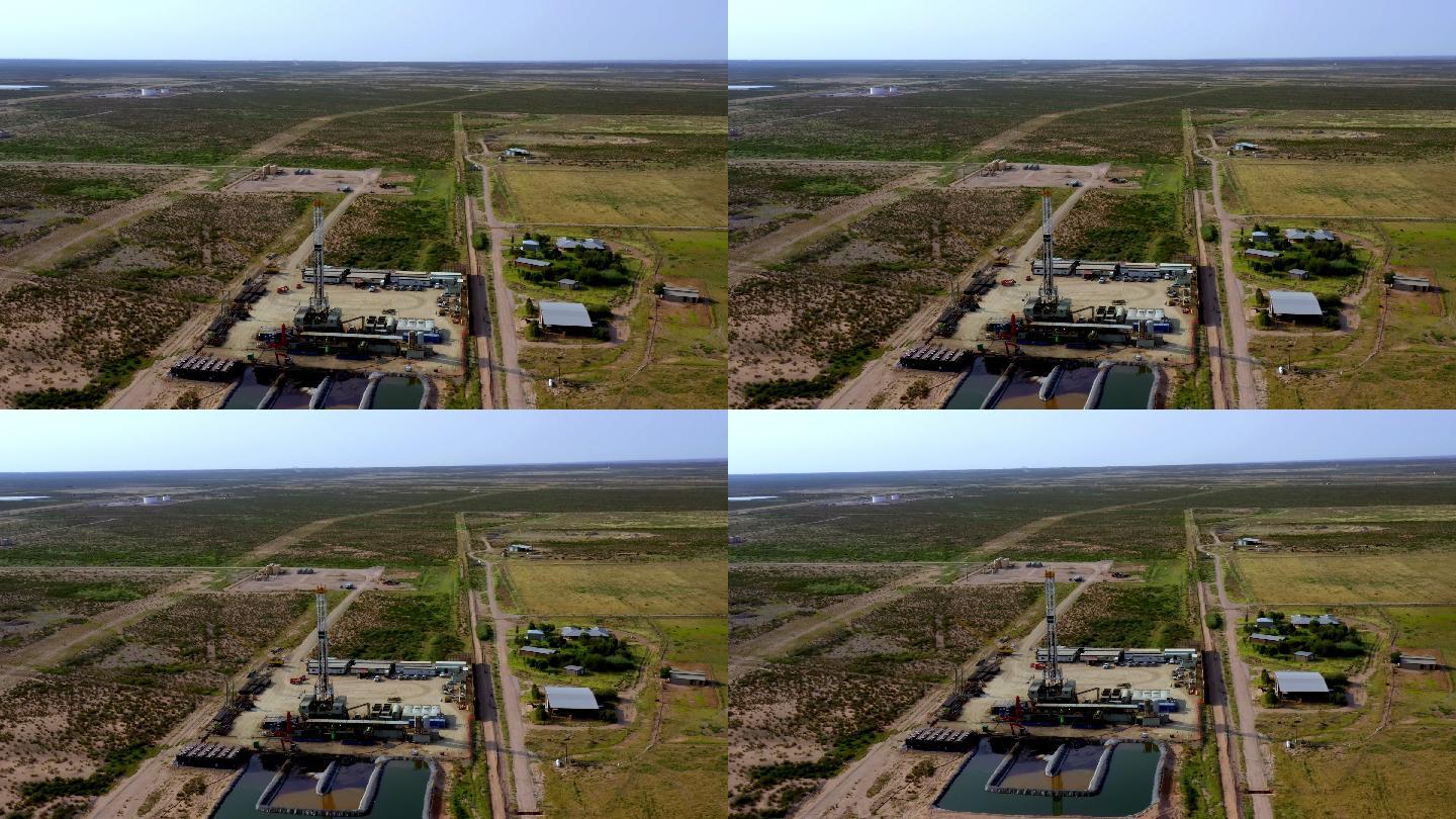 新墨西哥州水力压裂钻机显示储水池的空中无人机剪辑