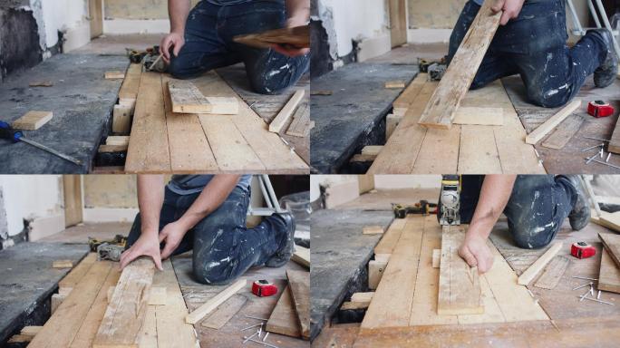 男建筑工人标记木地板
