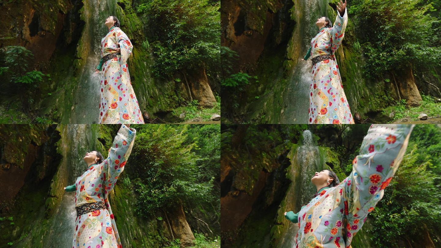 瀑布下的藏族女子