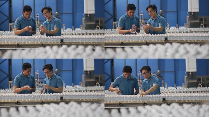 亚裔中国检查员在制造厂水瓶工厂展示新学员