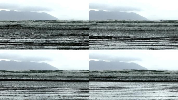 大西洋波浪滚滚到丁格尔半岛的英寸海滩上