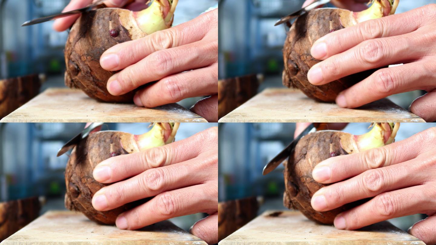 4K，手持式刀削芋头，放在木制砧板上烹饪