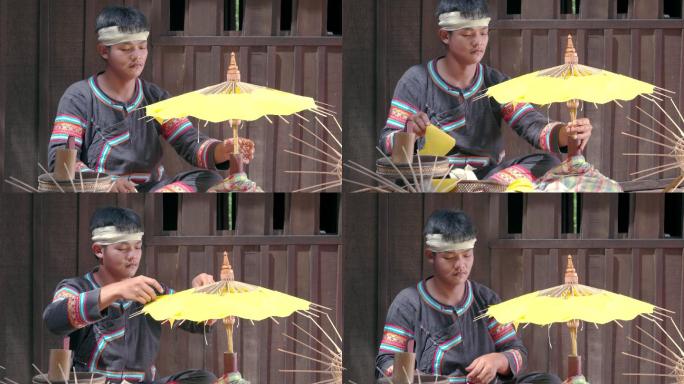 亚洲年轻人手工制作雨伞