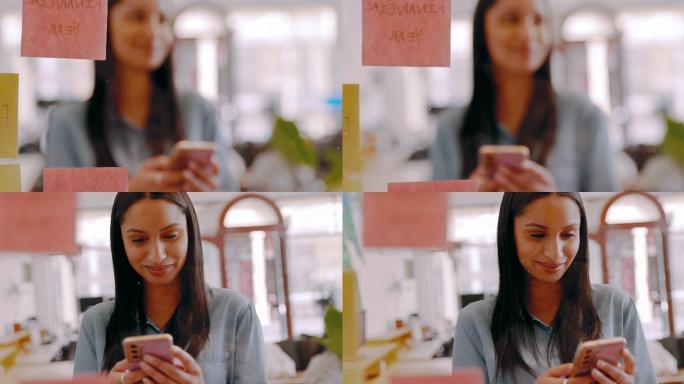 一名年轻女商人在办公室玻璃墙上头脑风暴时使用手机的4k视频片段