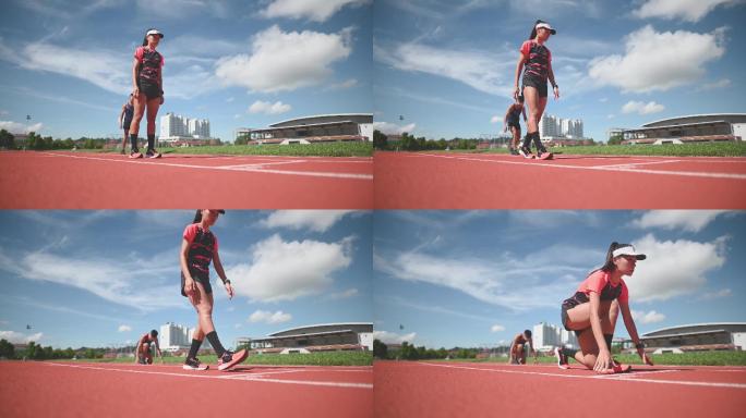 空气动力学亚裔中国男女运动员在田径场跑道上疾跑，并于上午向终点线跑去