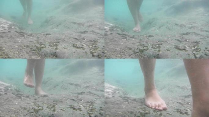 女人赤脚在水中行走