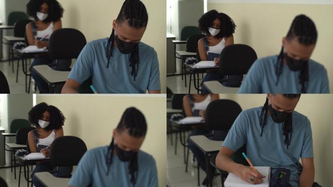 戴口罩的学生在学校上课学习