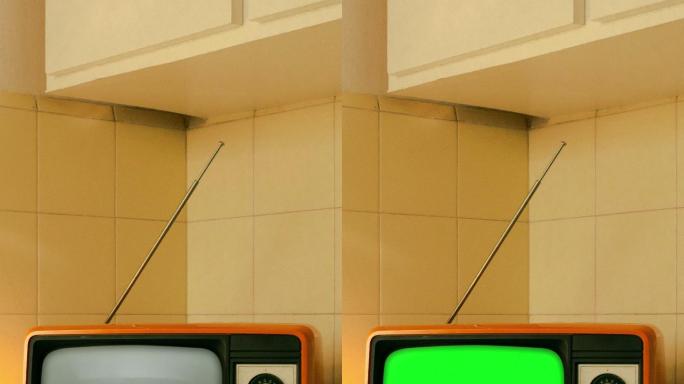 厨房柜台上的复古电视，带有彩色按键屏幕