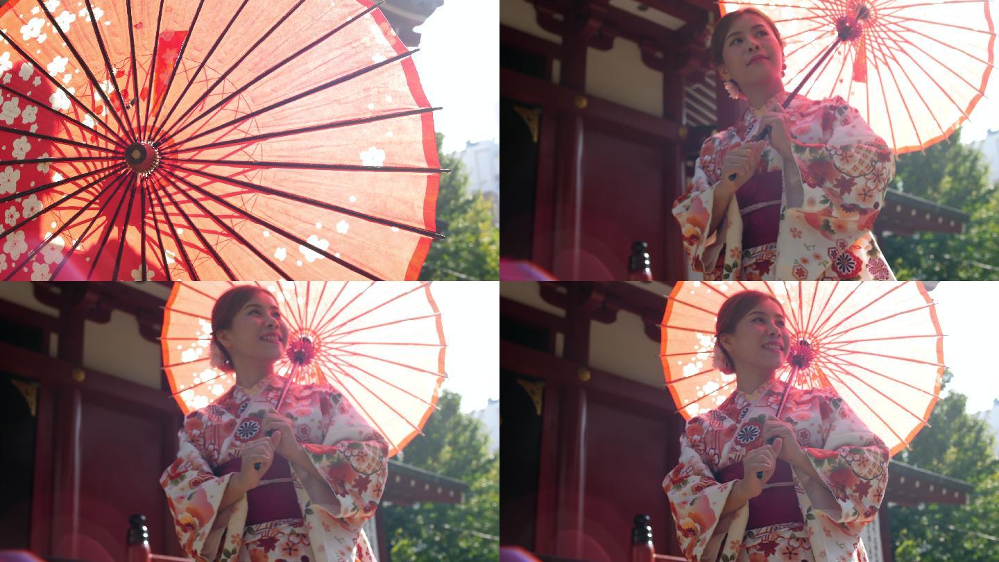 穿着传统日本和服打开雨伞