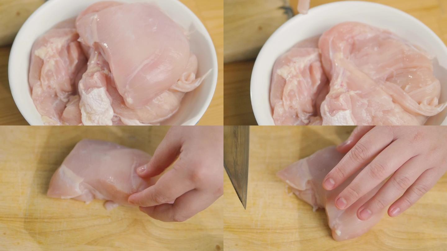 用手在砧板上切鸡肉，慢动作。