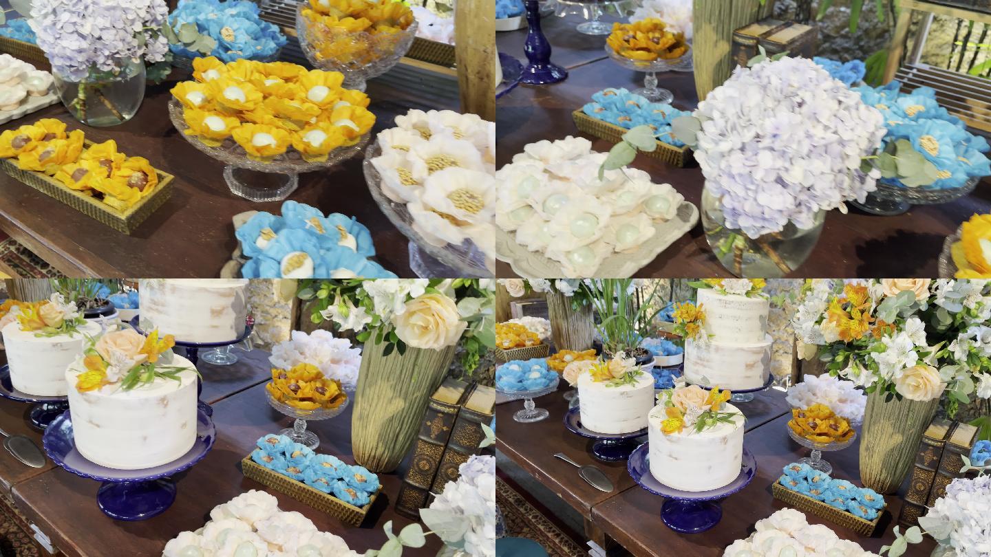 庆祝派对桌上摆满了五颜六色的糖果和鲜花