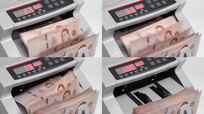 泰国钞票的慢镜头特写1000泰铢（1,00泰铢）在纸币计数器中计数，货币，计数，银行计数器，机器，纸