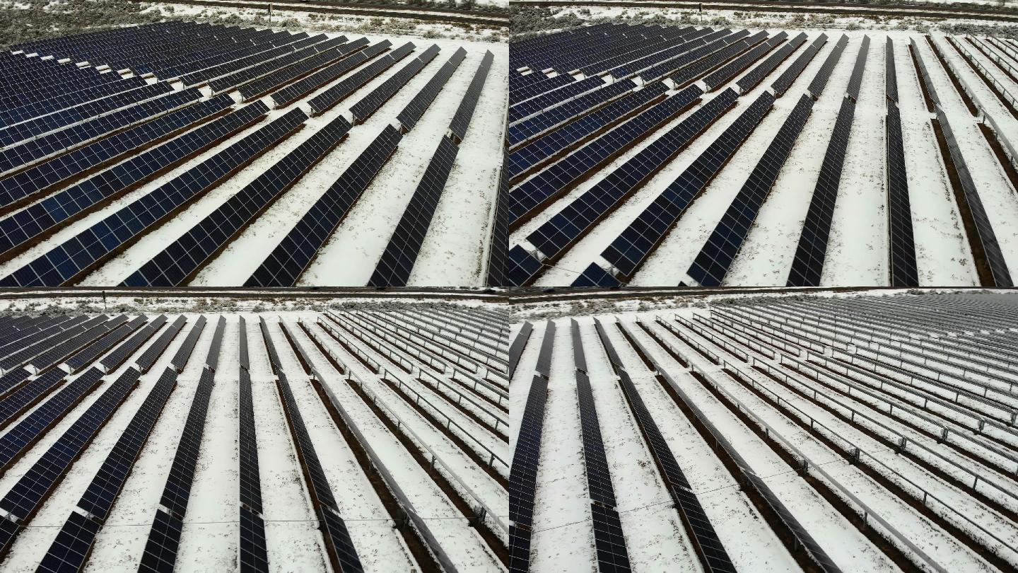 4k无人机拍摄的多排太阳能电池板农场在冬季公路附近的雪地中创造太阳能