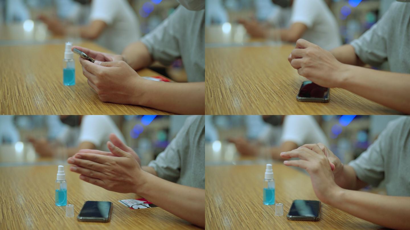 特写镜头。亚洲年轻男子在使用智能手机和社交距离前清洗消毒病毒