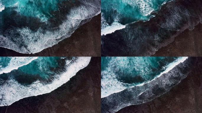 沿着巴厘岛海岸线飞溅的海浪