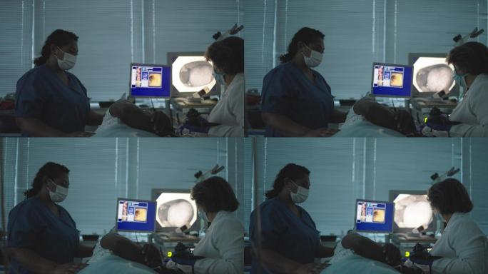 医生和护士用内窥镜检查患者