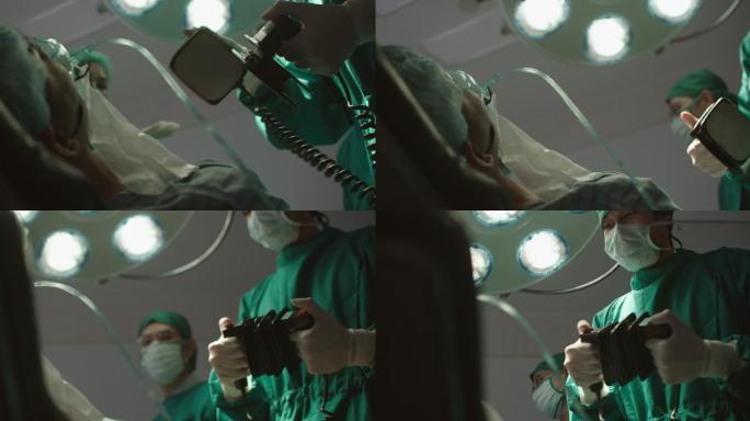 医疗团队在急诊室使用除颤器刺激心脏骤停后的心脏。