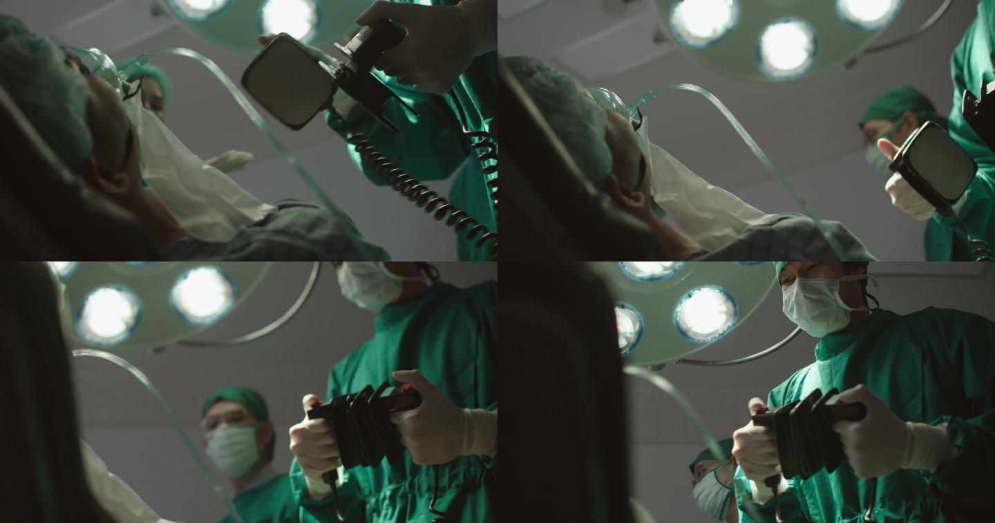 医疗团队在急诊室使用除颤器刺激心脏骤停后的心脏。