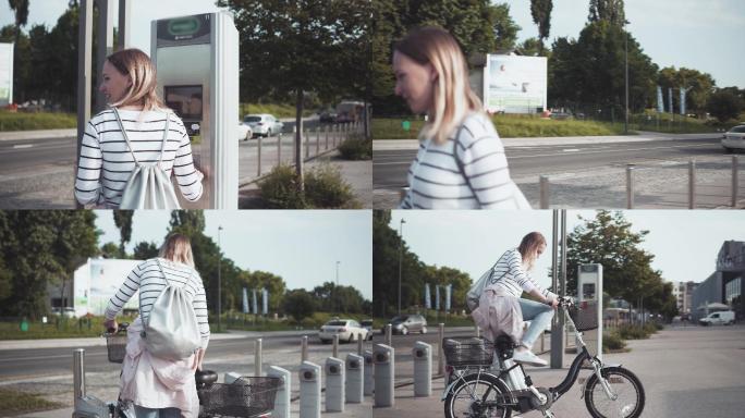 从自行车共享站拿自行车的女人