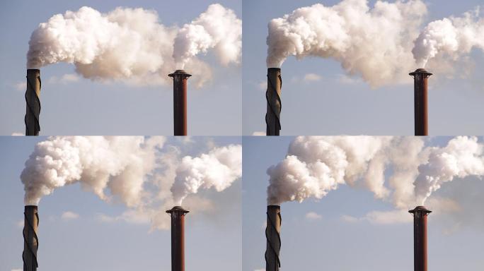 工厂午后阳光下的烟囱造成空气污染。