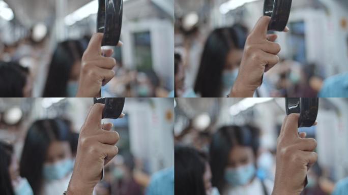 地铁列车扶手或扶手带的特写镜头，慢动作